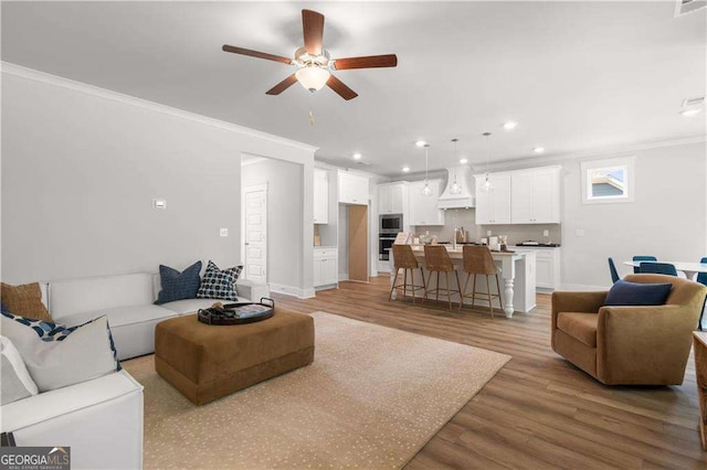 4038 Andover Cir, Mcdonough, GA 30252 - living room with baseboards, ceiling fan, crown molding, recessed lighting, and light wood finished floors