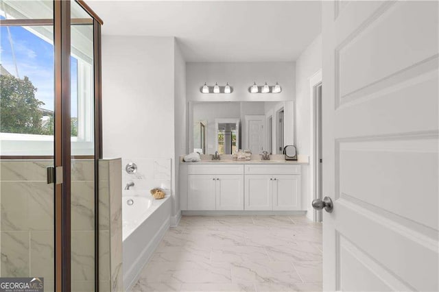 4038 Andover Cir, Mcdonough, GA 30252 - bathroom featuring a sink, a wealth of natural light, and marble finish floor