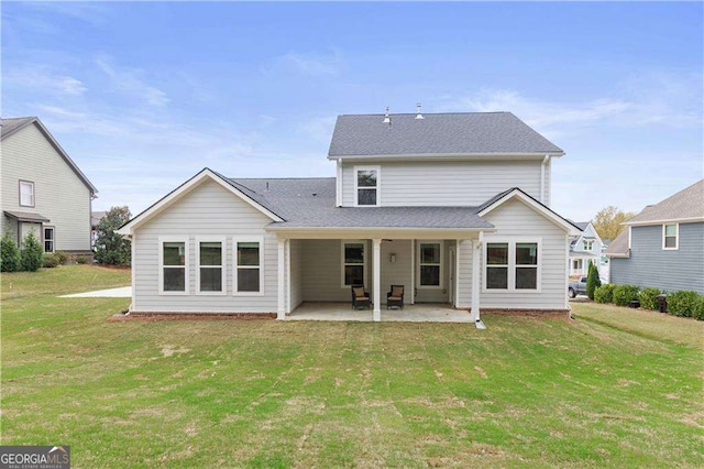 4038 Andover Cir, Mcdonough, GA 30252 - back of house with a patio, roof with shingles, and a yard