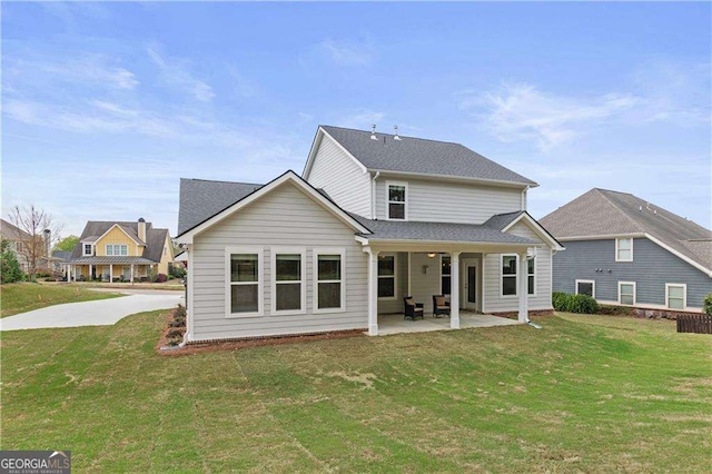 4038 Andover Cir, Mcdonough, GA 30252 - rear view of house with a patio area and a lawn