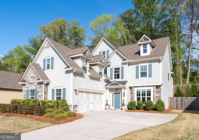 3087 Mountain Shadow Way, Marietta, GA 30064 - craftsman-style house with fence, concrete driveway, an attached garage, stone siding, and roof with shingles