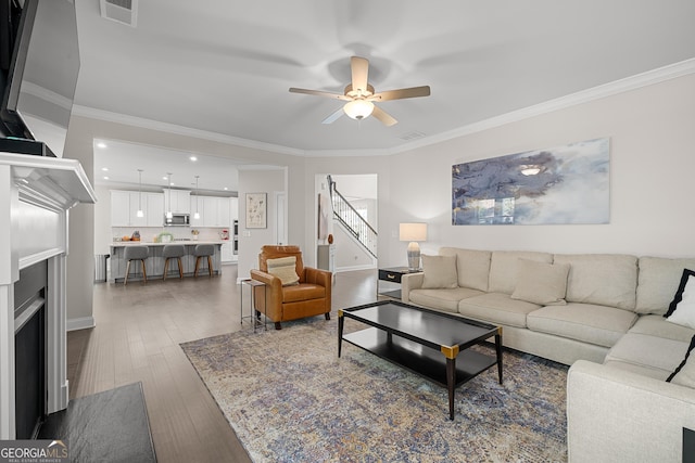 3087 Mountain Shadow Way, Marietta, GA 30064 - living area with visible vents, ornamental molding, dark wood-style floors, and ceiling fan