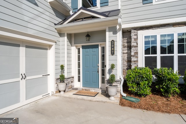 3087 Mountain Shadow Way, Marietta, GA 30064 - entrance to property featuring concrete driveway, stone siding, and a garage