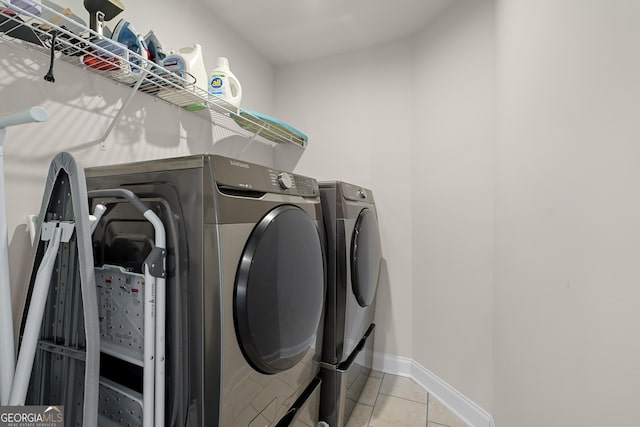 3087 Mountain Shadow Way, Marietta, GA 30064 - clothes washing area with washing machine and dryer, baseboards, laundry area, and light tile patterned flooring