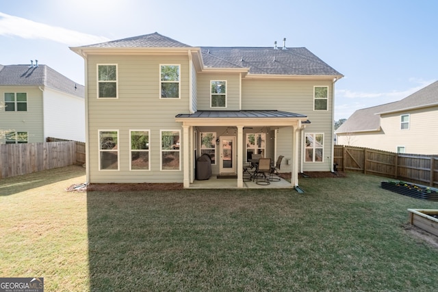 3087 Mountain Shadow Way, Marietta, GA 30064 - rear view of house with a yard, a fenced backyard, a patio, and a standing seam roof