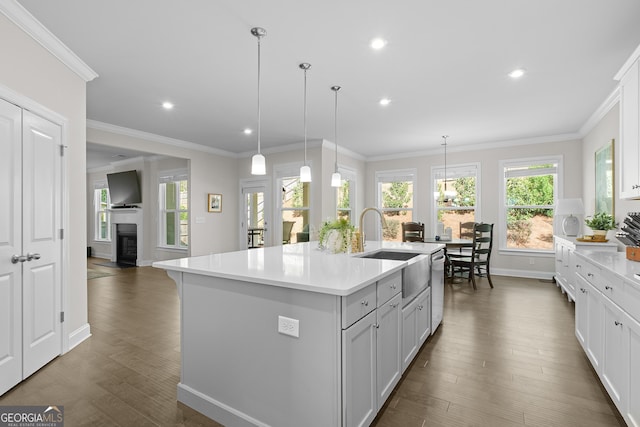 3087 Mountain Shadow Way, Marietta, GA 30064 - kitchen with light countertops, ornamental molding, baseboards, and dark wood-style flooring