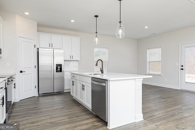 383 Cantrell Dr, Dallas, GA 30157 - kitchen with stainless steel appliances, light countertops, dark wood-style floors, and a sink