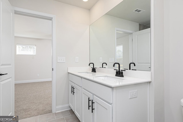 383 Cantrell Dr, Dallas, GA 30157 - bathroom featuring double vanity, a sink, baseboards, and visible vents