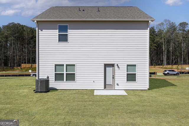 383 Cantrell Dr, Dallas, GA 30157 - back of property featuring central AC, roof with shingles, and a lawn