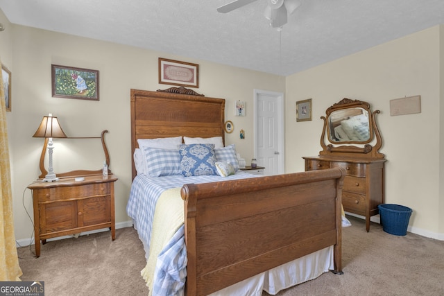 bedroom with ceiling fan, carpet flooring, and baseboards