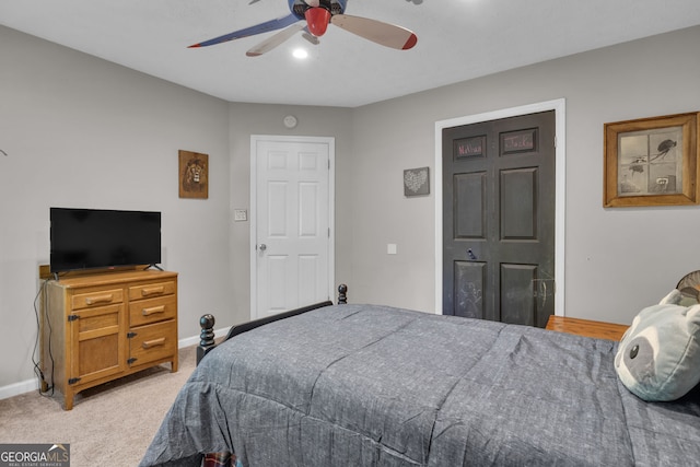 carpeted bedroom with baseboards and a ceiling fan