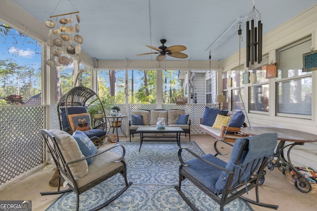 sunroom featuring outdoor lounge area, plenty of natural light, and a ceiling fan
