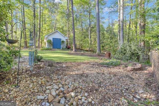 view of yard with an outbuilding and a shed