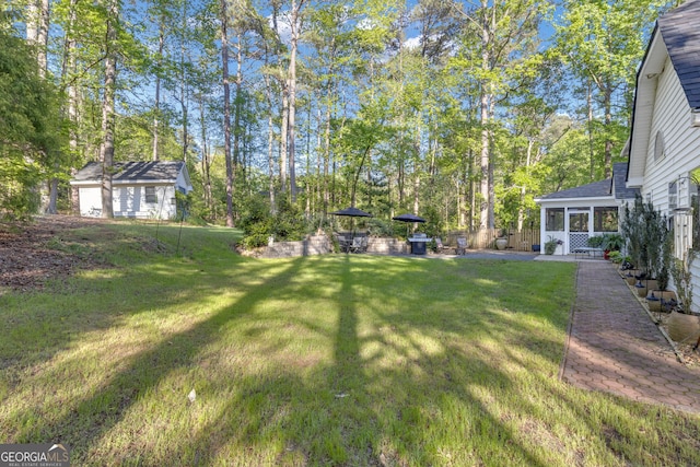 view of yard with a sunroom