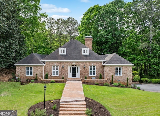 8925 Huntcliff Lake Ct, Atlanta, GA 30350 - view of front facade featuring brick siding, a shingled roof, a front yard, and a chimney