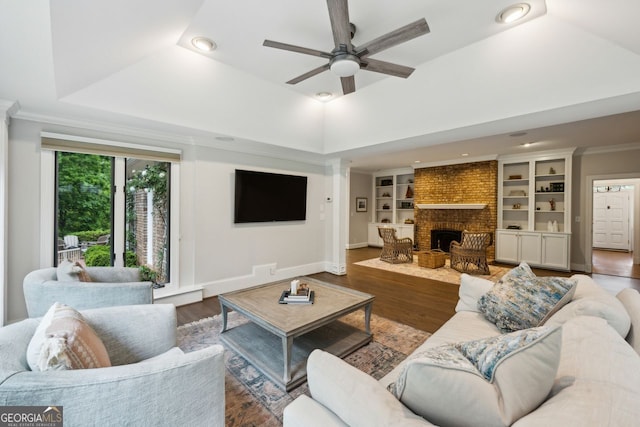 8925 Huntcliff Lake Ct, Atlanta, GA 30350 - living room featuring a brick fireplace, wood finished floors, baseboards, recessed lighting, and a ceiling fan