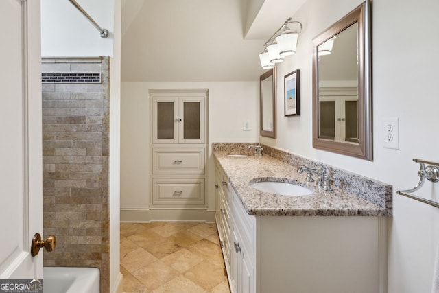 8925 Huntcliff Lake Ct, Atlanta, GA 30350 - bathroom with double vanity, a sink, and shower / bathtub combination
