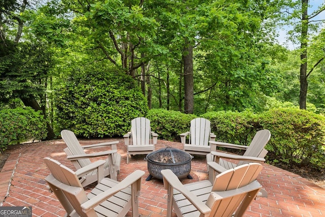 8925 Huntcliff Lake Ct, Atlanta, GA 30350 - view of patio / terrace with an outdoor fire pit