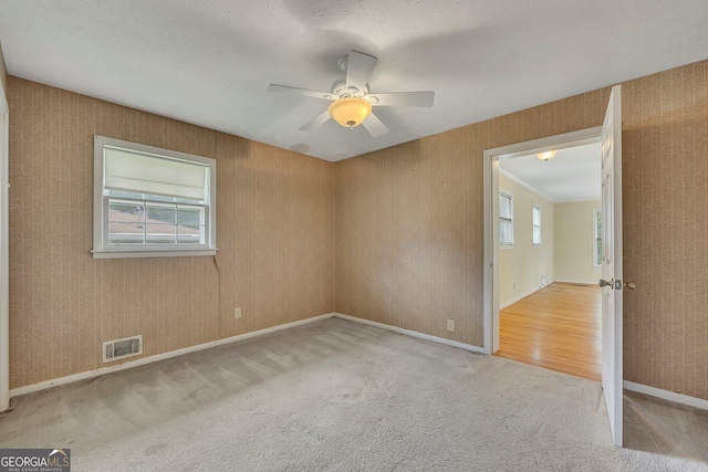 4164 Weston Dr, Powder Springs, GA 30127 - unfurnished room featuring healthy amount of natural light, ceiling fan, carpet, and baseboards