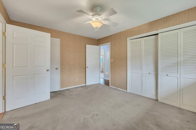 4164 Weston Dr, Powder Springs, GA 30127 - unfurnished bedroom with carpet, a closet, ceiling fan, and wallpapered walls