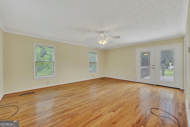 4164 Weston Dr, Powder Springs, GA 30127 - spare room with healthy amount of natural light, light wood-style flooring, ceiling fan, baseboards, and crown molding
