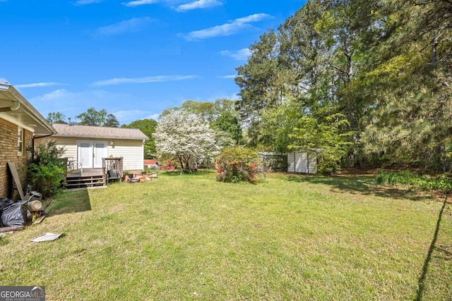 4164 Weston Dr, Powder Springs, GA 30127 - view of grassy yard with a wooden deck