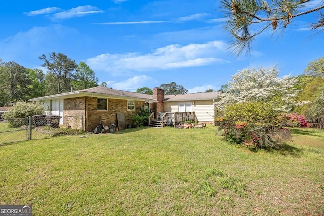 4164 Weston Dr, Powder Springs, GA 30127 - back of house featuring a wooden deck, brick siding, a chimney, and a gate