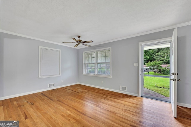 4164 Weston Dr, Powder Springs, GA 30127 - empty room featuring ornamental molding, light wood-type flooring, ceiling fan, baseboards, and a textured ceiling