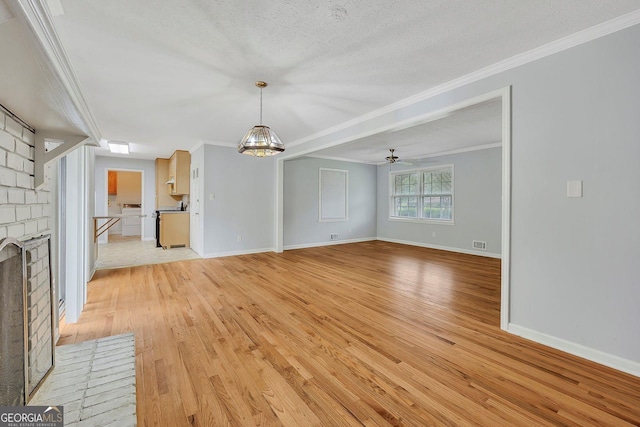 4164 Weston Dr, Powder Springs, GA 30127 - unfurnished living room featuring a fireplace, light wood-style floors, crown molding, baseboards, and a ceiling fan