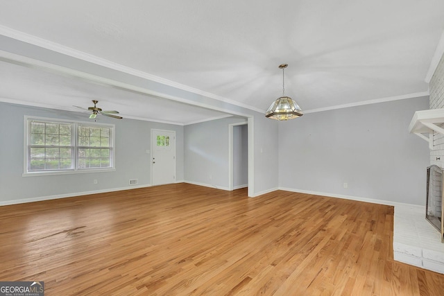 4164 Weston Dr, Powder Springs, GA 30127 - unfurnished living room with light wood-type flooring, a fireplace, ceiling fan, baseboards, and ornamental molding