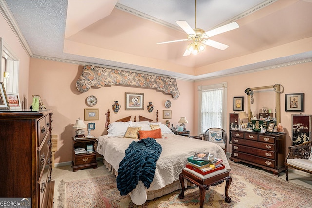 110 Emerald Dr, Mcdonough, GA 30253 - bedroom featuring crown molding, a tray ceiling, ceiling fan, and light carpet