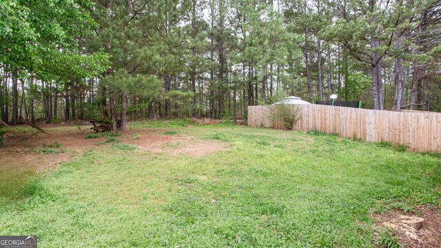 view of yard with fence