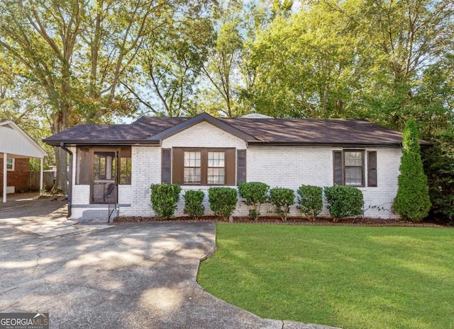 1340 Hawthorne Ave SE, Smyrna, GA 30080 - ranch-style house featuring a front yard and brick siding