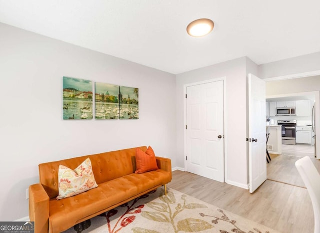 1340 Hawthorne Ave SE, Smyrna, GA 30080 - living area with baseboards and light wood-type flooring