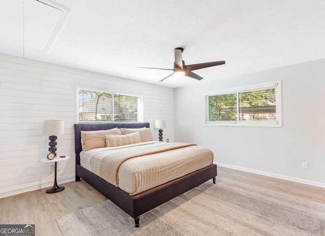 1340 Hawthorne Ave SE, Smyrna, GA 30080 - bedroom featuring multiple windows, attic access, and wood finished floors