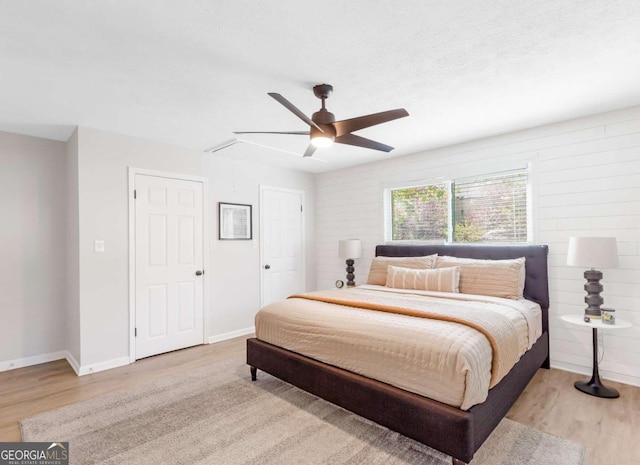 1340 Hawthorne Ave SE, Smyrna, GA 30080 - bedroom featuring baseboards, attic access, a ceiling fan, and wood finished floors