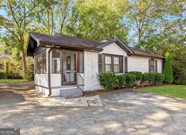 1340 Hawthorne Ave SE, Smyrna, GA 30080 - view of front facade featuring a sunroom and brick siding