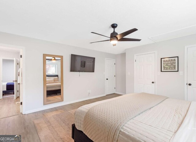 1340 Hawthorne Ave SE, Smyrna, GA 30080 - bedroom featuring ceiling fan, light wood-type flooring, attic access, and baseboards