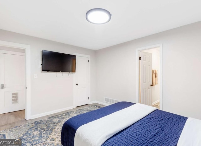 1340 Hawthorne Ave SE, Smyrna, GA 30080 - bedroom with wood finished floors, baseboards, and visible vents
