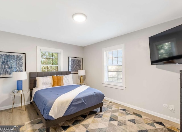 1340 Hawthorne Ave SE, Smyrna, GA 30080 - bedroom with wood finished floors and baseboards