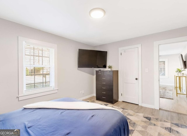 1340 Hawthorne Ave SE, Smyrna, GA 30080 - bedroom featuring light wood-style flooring and baseboards