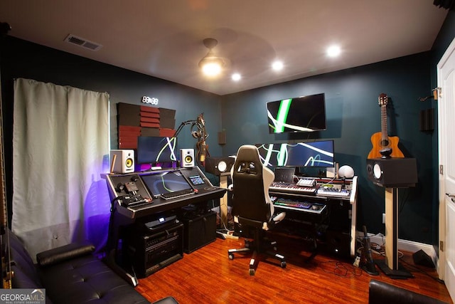 office with visible vents and wood finished floors