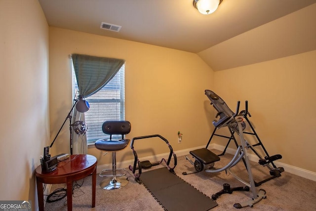 workout area with carpet floors, baseboards, vaulted ceiling, and visible vents