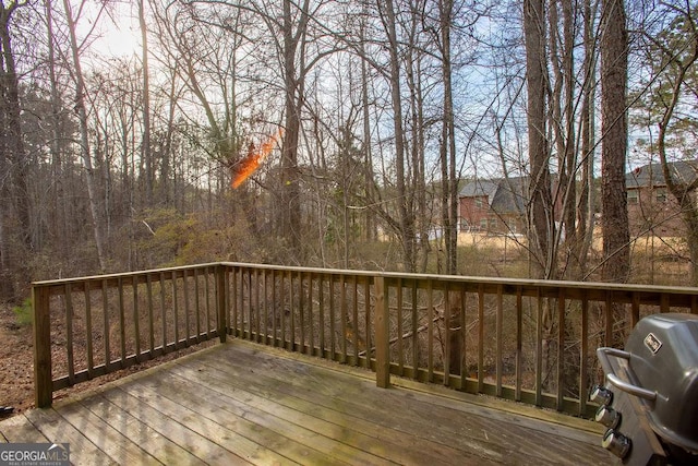 wooden deck with area for grilling