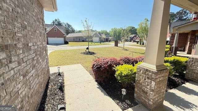 view of yard featuring a residential view
