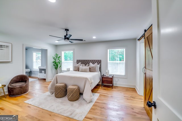 3244 Mount Olive Rd, Atlanta, GA 30344 - bedroom featuring a barn door, light wood finished floors, baseboards, recessed lighting, and a ceiling fan