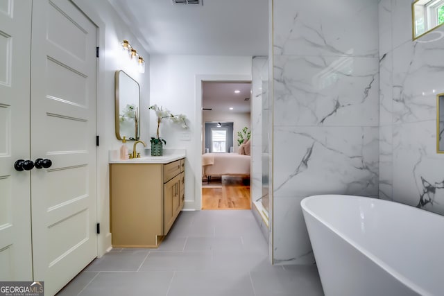 3244 Mount Olive Rd, Atlanta, GA 30344 - bathroom with vanity, healthy amount of natural light, a freestanding tub, and ensuite bathroom