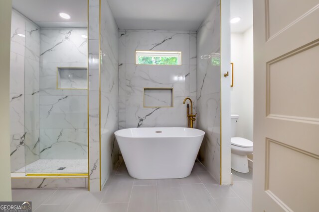 3244 Mount Olive Rd, Atlanta, GA 30344 - full bathroom with toilet, a freestanding bath, tile patterned floors, and a marble finish shower