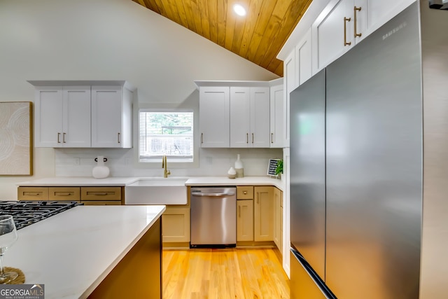 3244 Mount Olive Rd, Atlanta, GA 30344 - kitchen featuring stainless steel appliances, a sink, vaulted ceiling, wooden ceiling, and backsplash