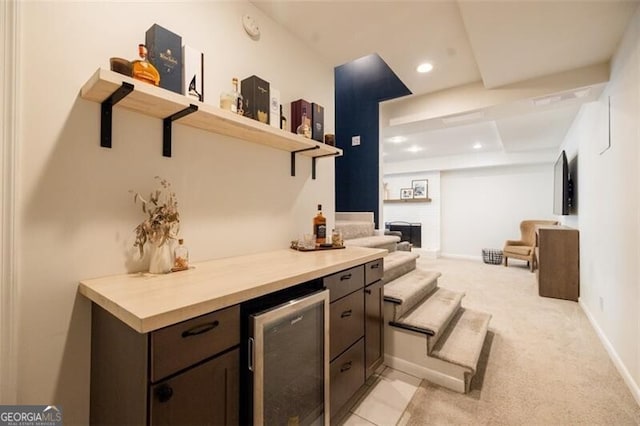 indoor dry bar with wine cooler, light carpet, baseboards, and recessed lighting